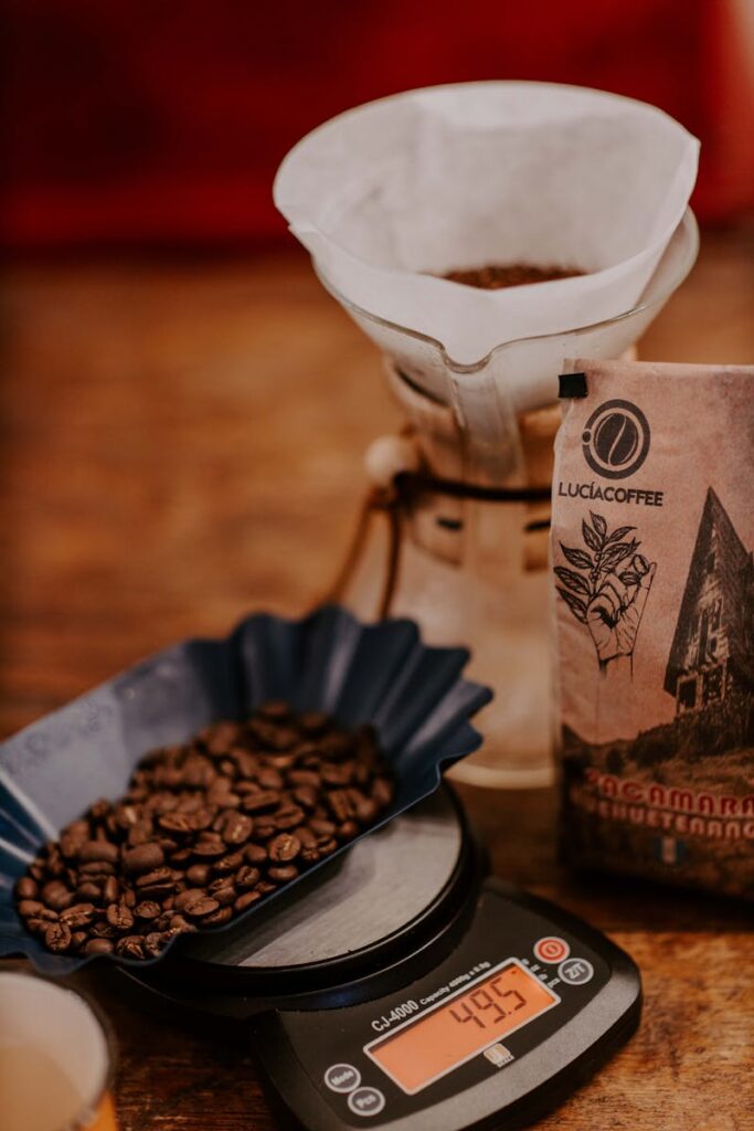 Close-up of coffee beans on a scale with dripper and packaging in Huehuetenango, Guatemala.